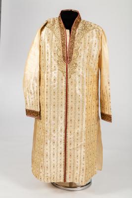 An Indian cream silk coat with gold