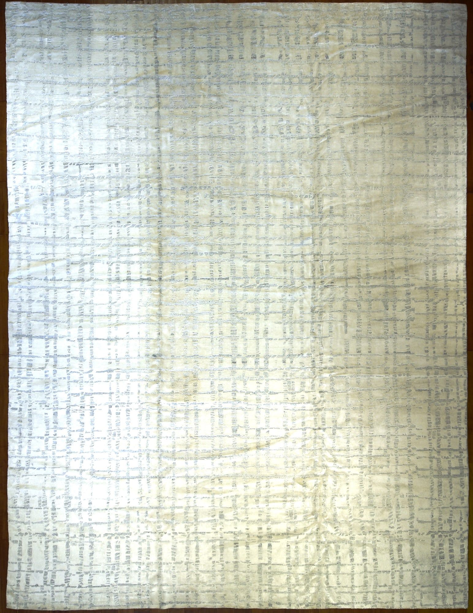 AN INDIAN HAND KNOTTED RUG,