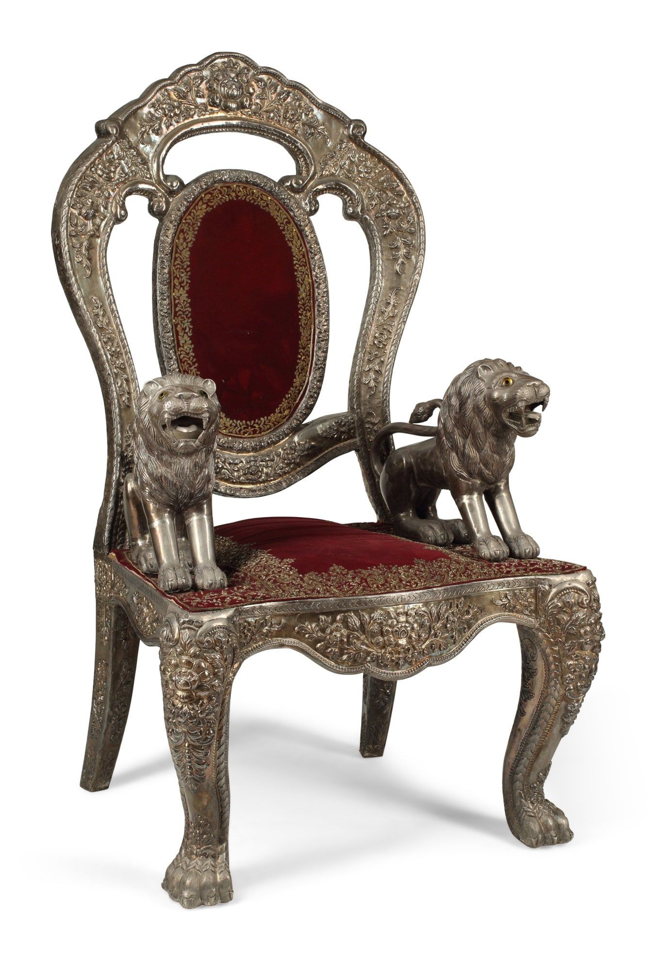 AN INDIAN SILVERED METAL ARMCHAIRAn