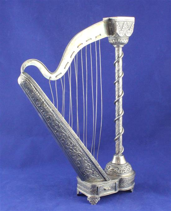 An Indian white metal novelty