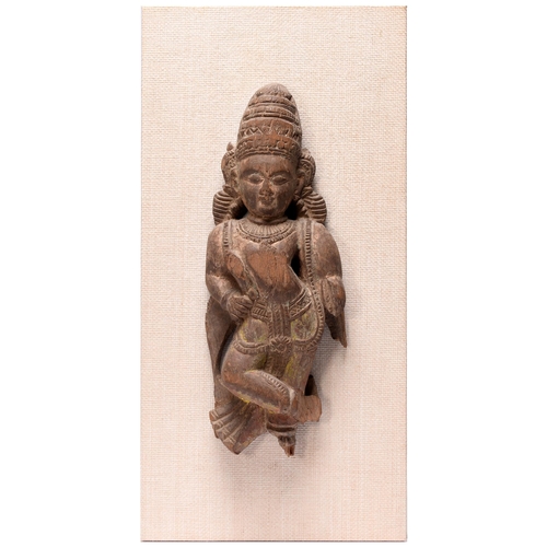 An Indian wood sculpture of an