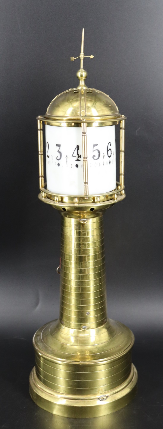 AN INDUSTRIAL BRASS LIGHTHOUSE