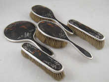 An inlaid tortoiseshell backed