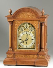 AN INLAID WALNUT CHIMING BRACK