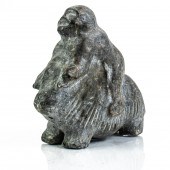AN INUIT BASALT FIGURE OF MAN