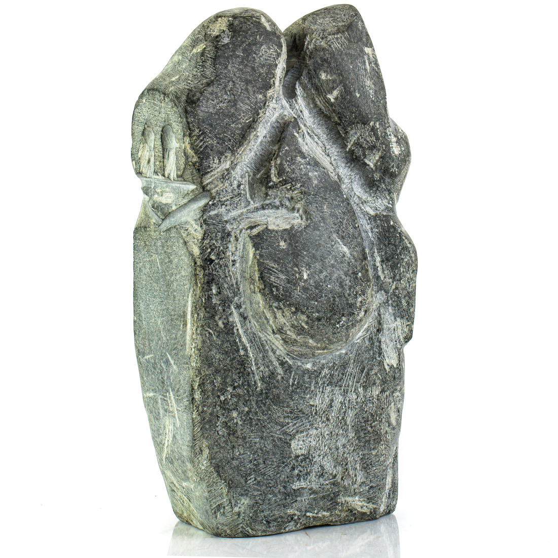 AN INUIT BASALT FIGURE OF A
