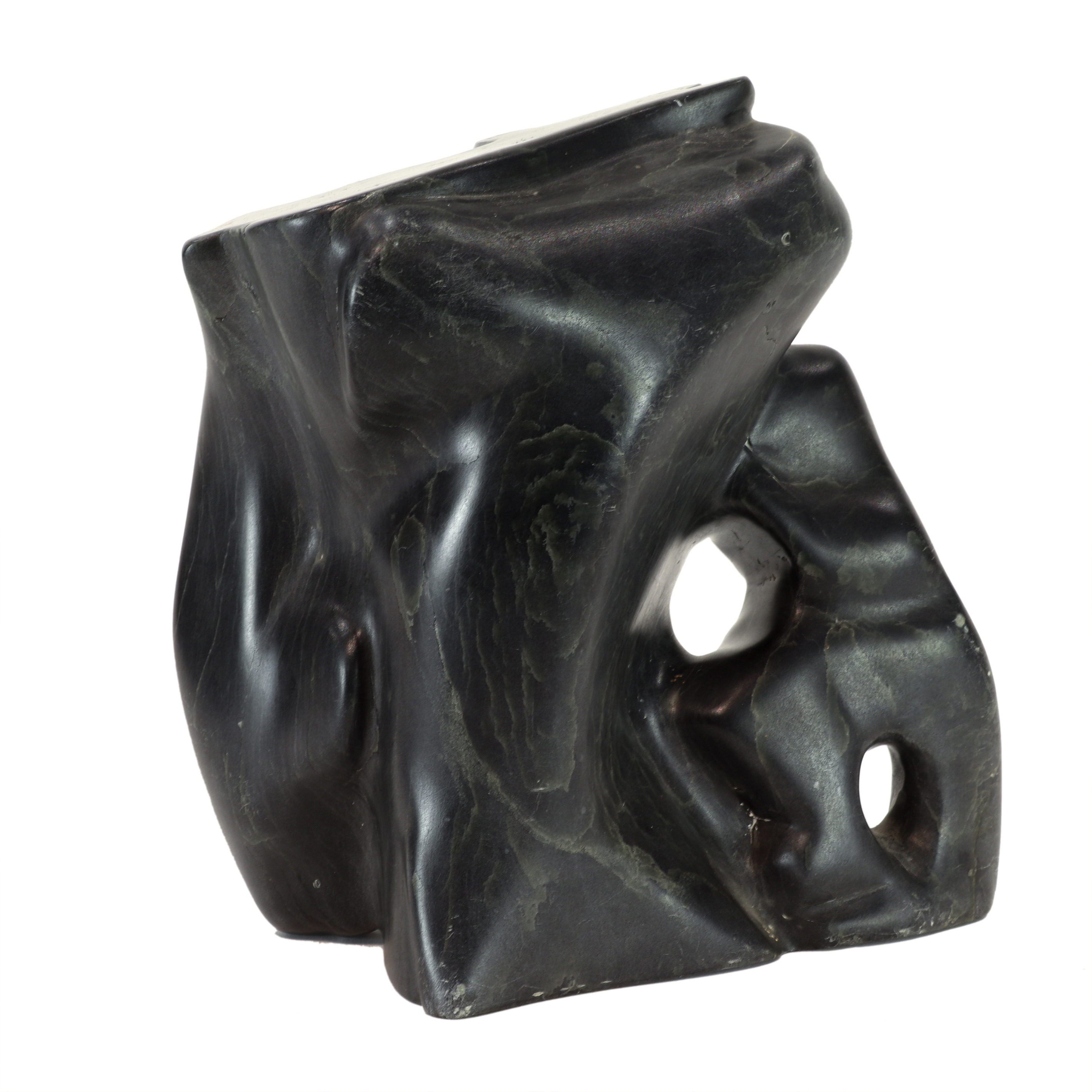 AN INUIT CARVED STONE FIGURAL GROUP