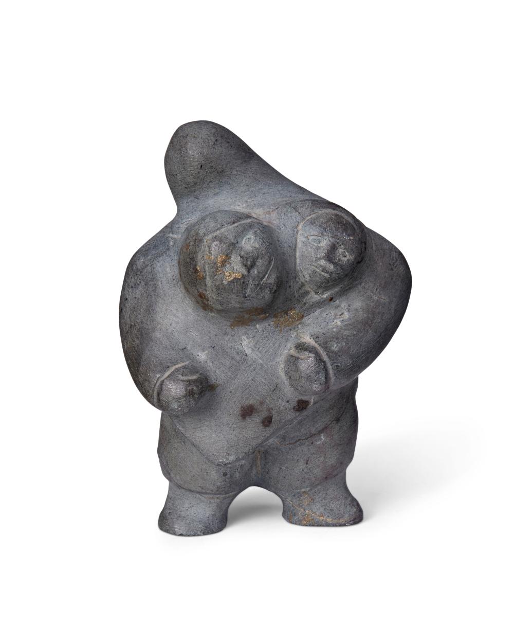 AN INUIT CARVED STONE FIGURAL