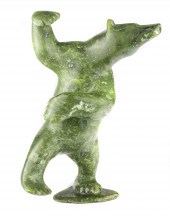 AN INUIT FIGURAL SCULPTURE BY