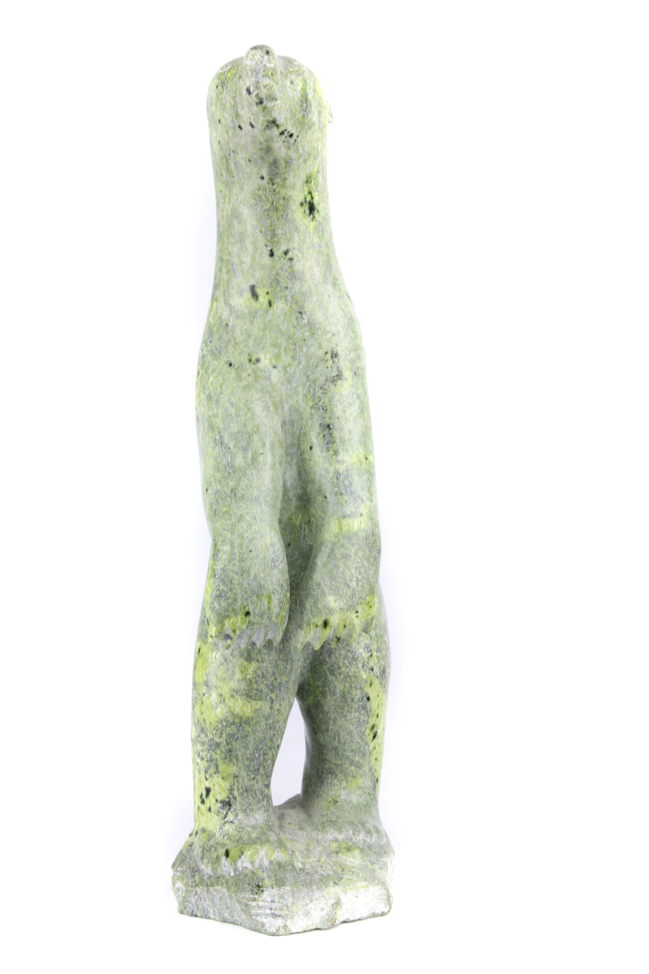 AN INUIT FIGURAL SCULPTURE BY