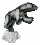 AN INUIT FIGURAL SCULPTURE OF
