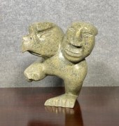 An Inuit green soapstone sculp