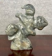 An Inuit grey soapstone sculpt