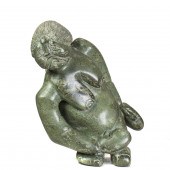 AN INUIT SERPENTINE FIGURE OF