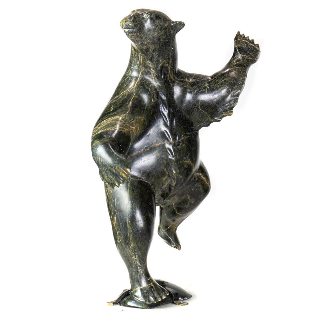 AN INUIT SERPENTINE FIGURE OF A