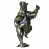AN INUIT SERPENTINE FIGURE OF
