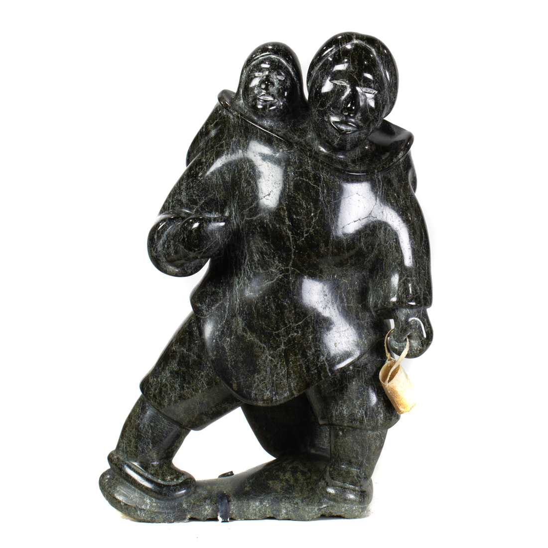 AN INUIT SERPENTINE FIGURE OF A