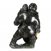 AN INUIT SERPENTINE FIGURE OF