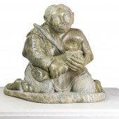 AN INUIT SERPENTINE FIGURE OF