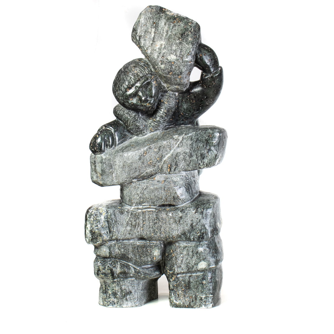 AN INUIT SOAPSTONE FIGURE OF A