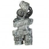 AN INUIT SOAPSTONE FIGURE OF A