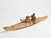 AN INUIT UMIAK BOAT WITH TWO M