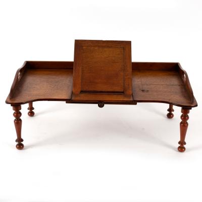 An invalid's bed table with reading