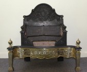 An iron and brass fire grate t