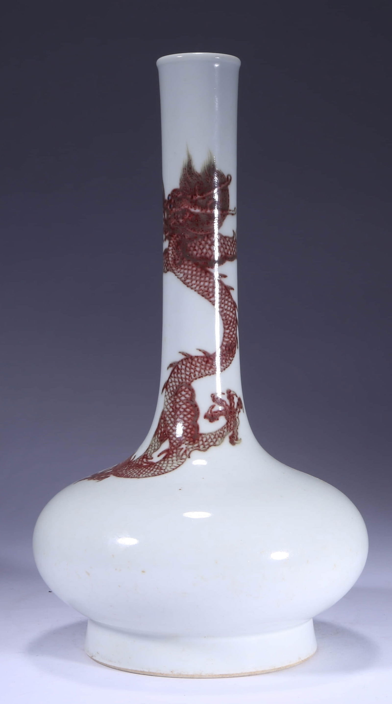 AN IRON-RED 'DRAGON' LONG-NECKED