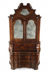 AN ITALIAN BAROQUE STYLE WALNU