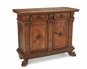 AN ITALIAN CARVED FRUITWOOD CA