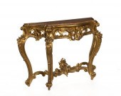 AN ITALIAN CARVED GILTWOOD CON