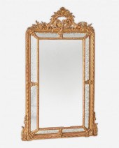 AN ITALIAN CARVED GILTWOOD WAL
