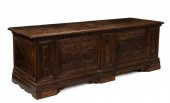AN ITALIAN CARVED WALNUT CASSO
