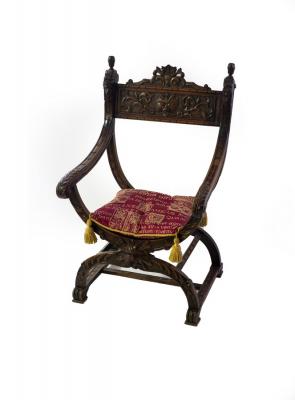 An Italian carved walnut X-framed
