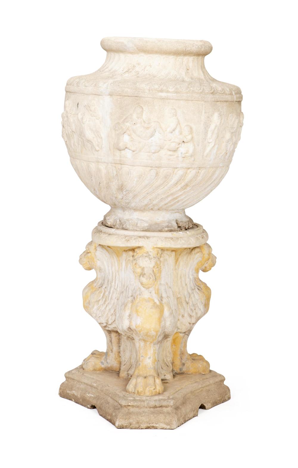 AN ITALIAN CAST STONE URN ON