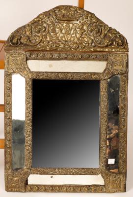 An Italian embossed brass mirror,