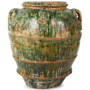An Italian Green Glazed Terra Cotta