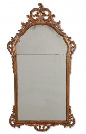 AN ITALIAN ROCOCO GILTWOOD MIR