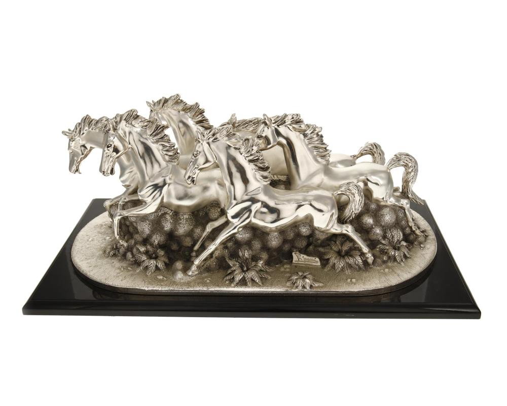 AN ITALIAN SILVER-CLAD SCULPTURE OF