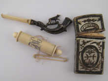 An ivory and white metal