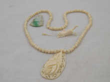 An ivory bead necklace with