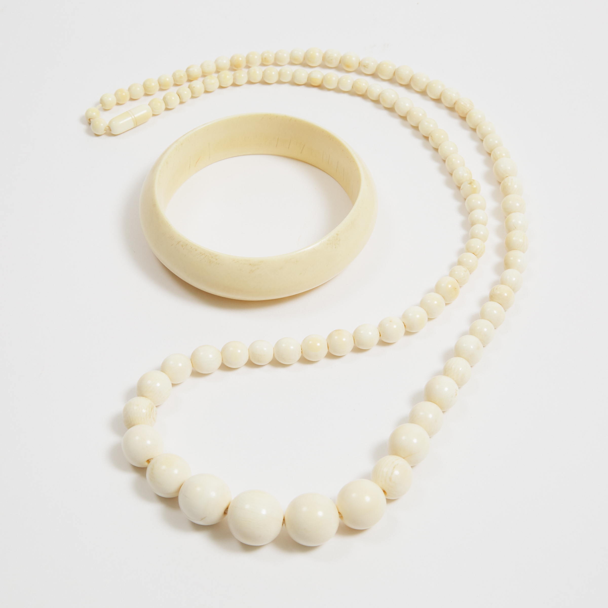 An Ivory Beaded Necklace and