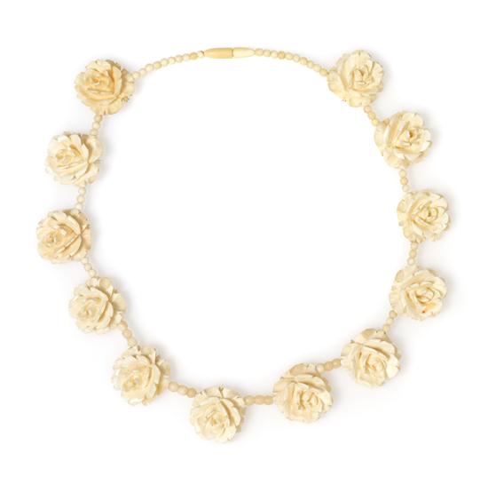 *An Ivory Carved Bead Necklace.