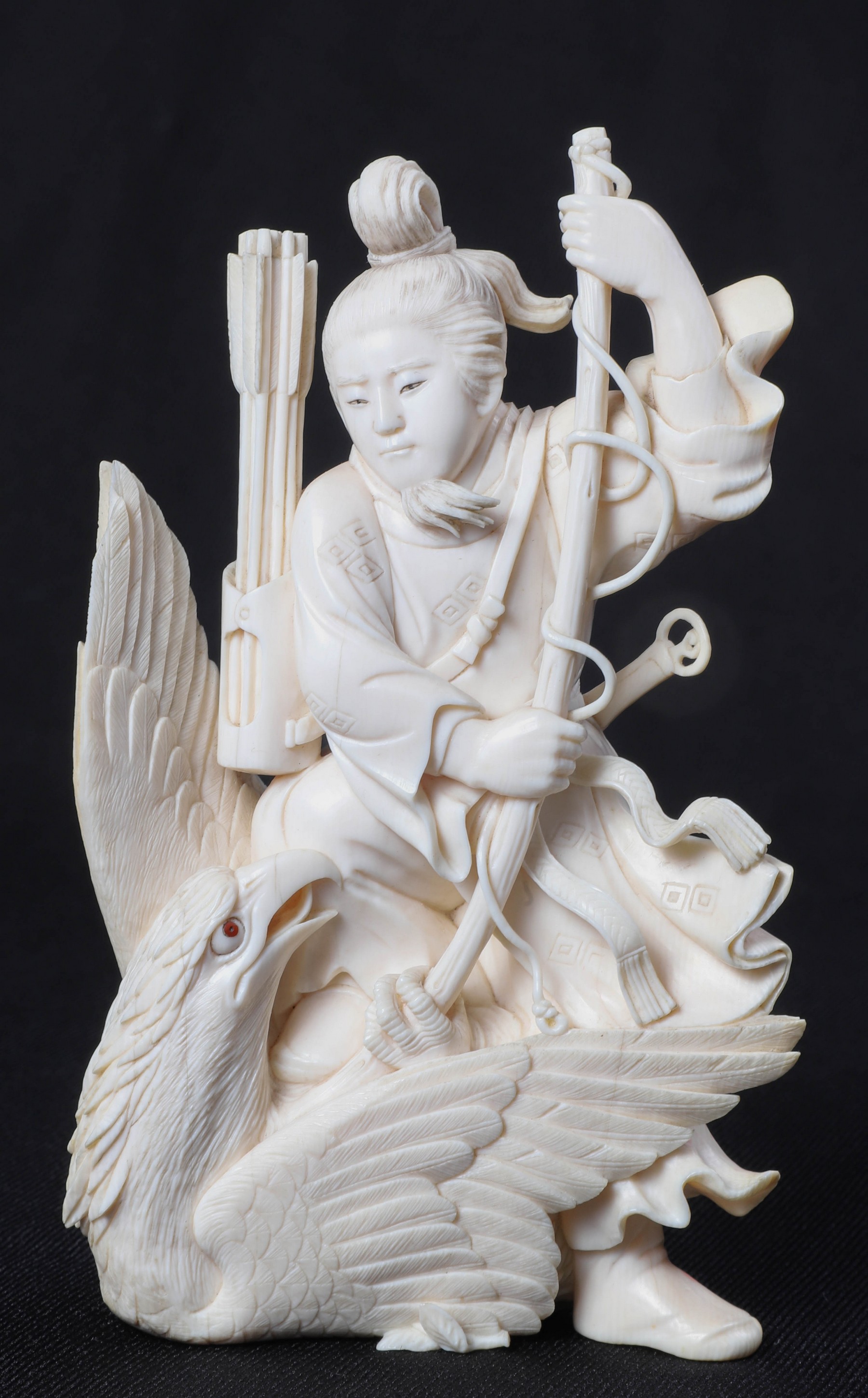 An ivory figure with hawk, robe