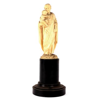 An ivory group of St. Joseph,