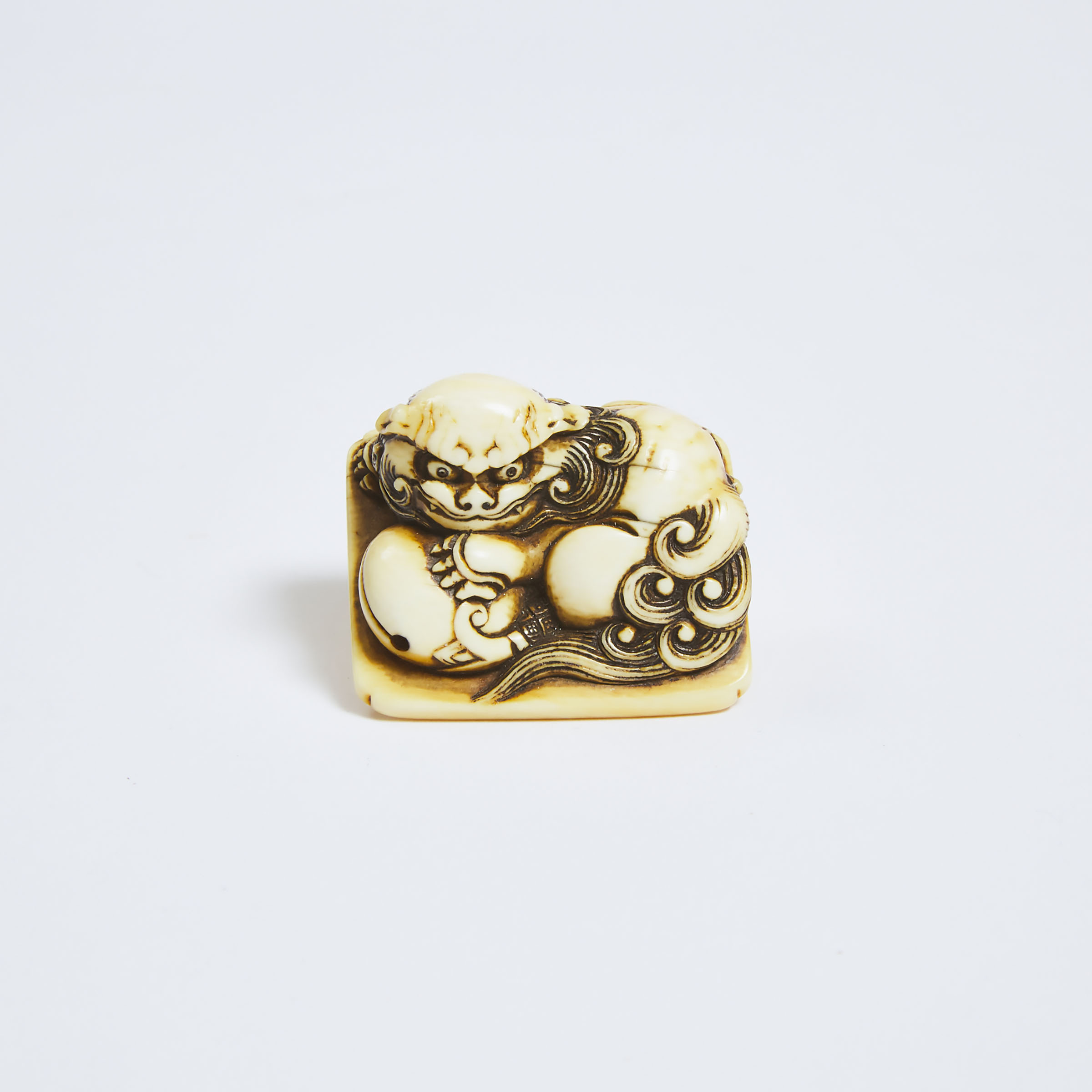 An Ivory Netsuke of a Recumbent