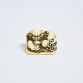An Ivory Netsuke of a Recumben