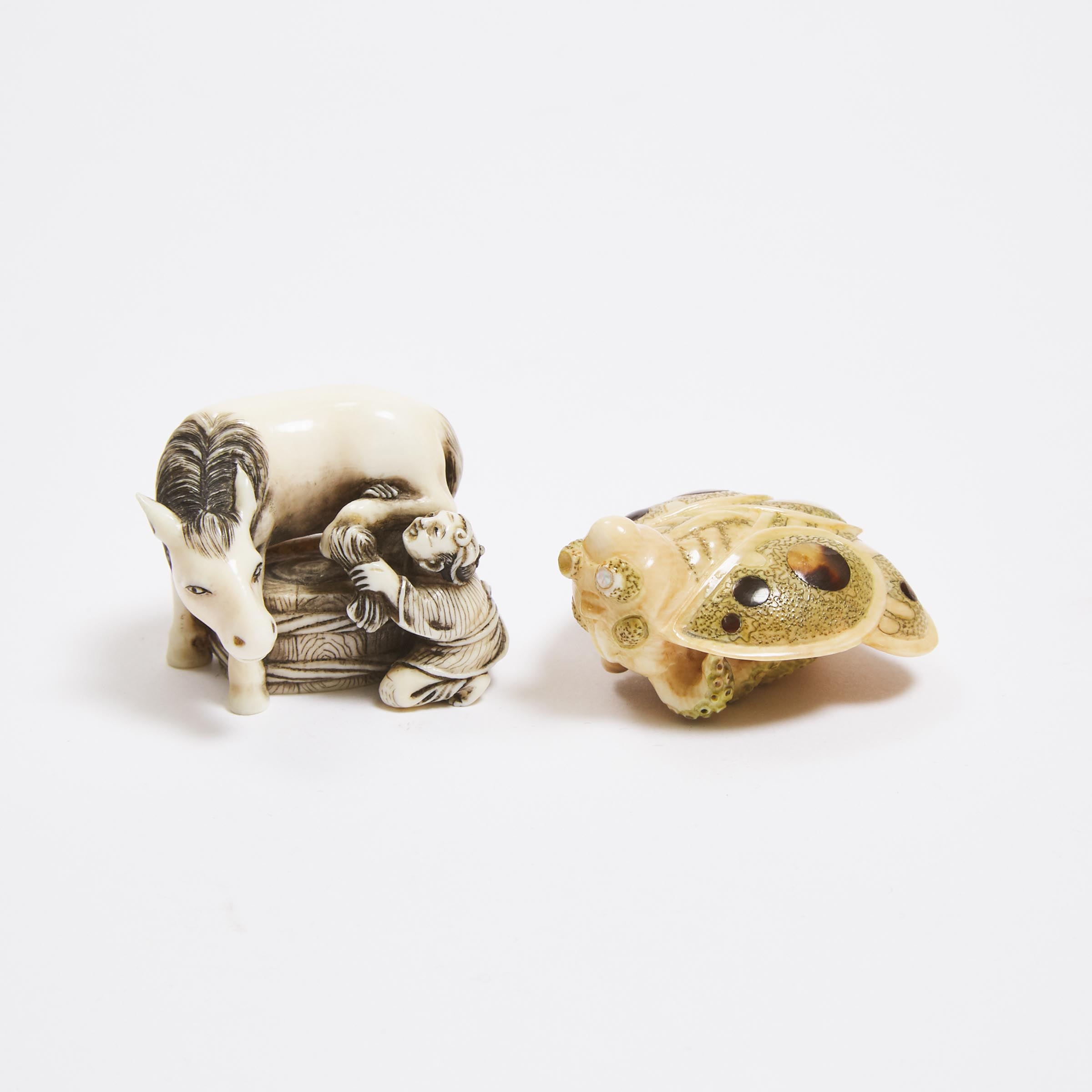 An Ivory Netsuke of a Boy Washing a