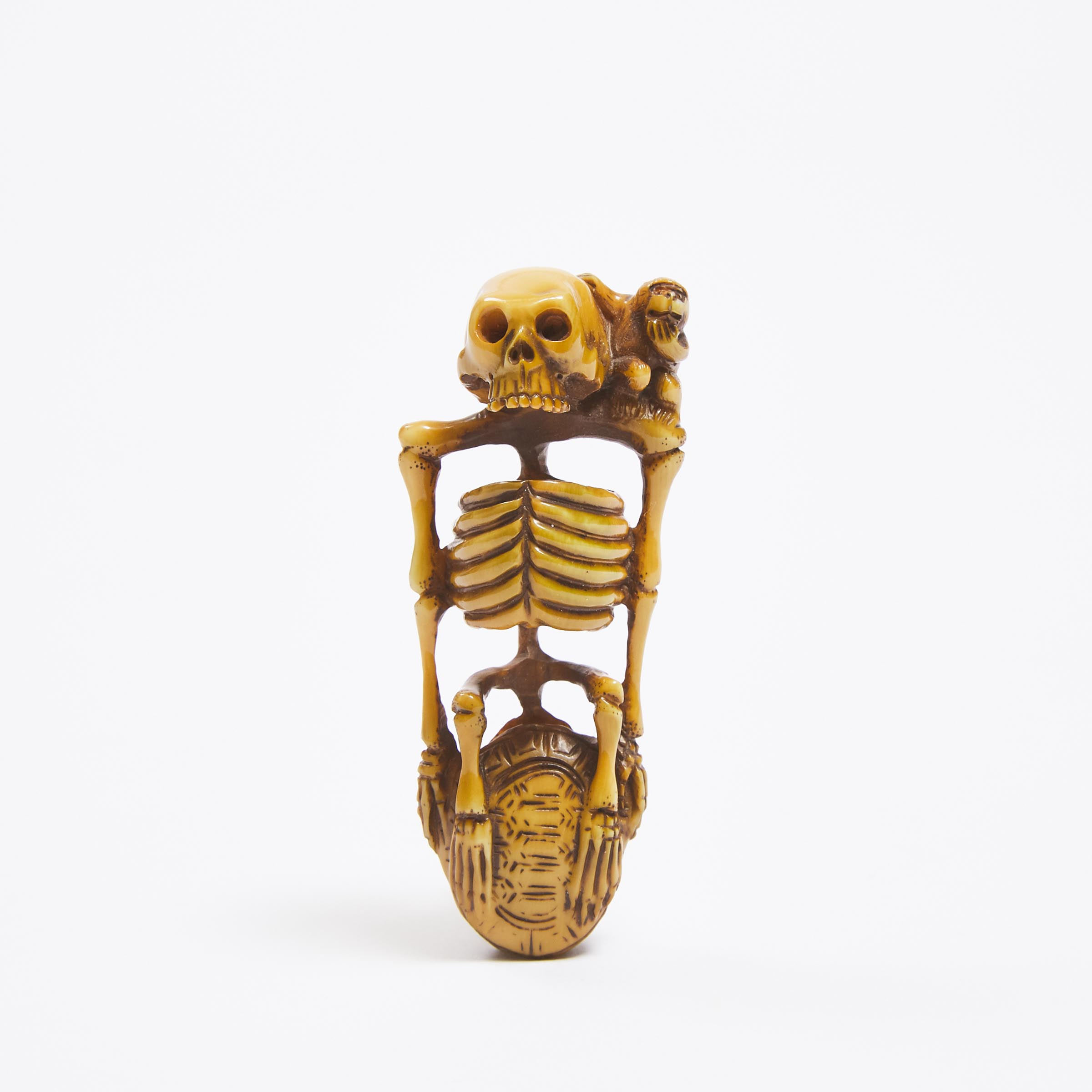 An Ivory Netsuke of a Skeleton,